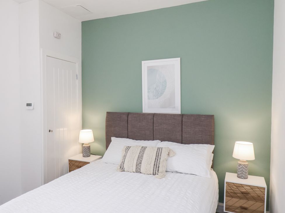 A bedroom with a bed and bedside tables at Apartment 2 in Redcar