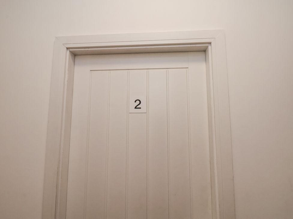 A door with number 2 in a hallway at Apartment 2 Redcar