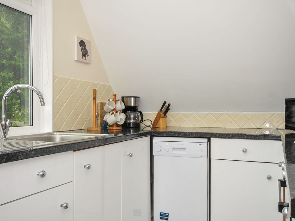 A kitchen with a sink and dishwasher at Valley Lodge 2 Callington