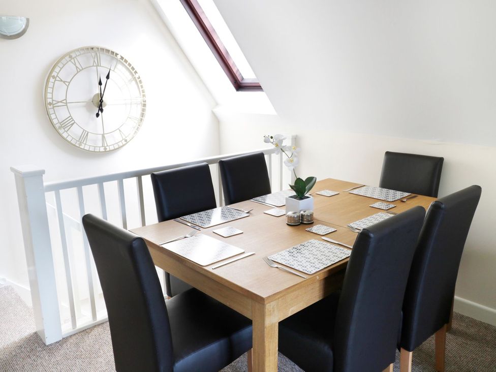 A dining room with a table and chairs at Valley Lodge 2 Callington