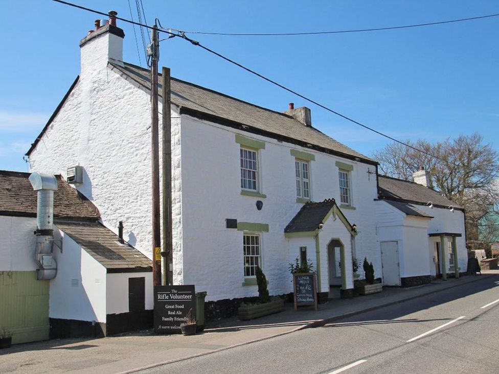 A building with a sign and windows at Valley Lodge 2 in Callington