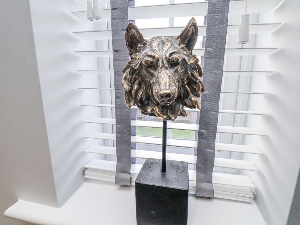 A wolf head sculpture on a windowsill at Pearl Stone House in Whitby