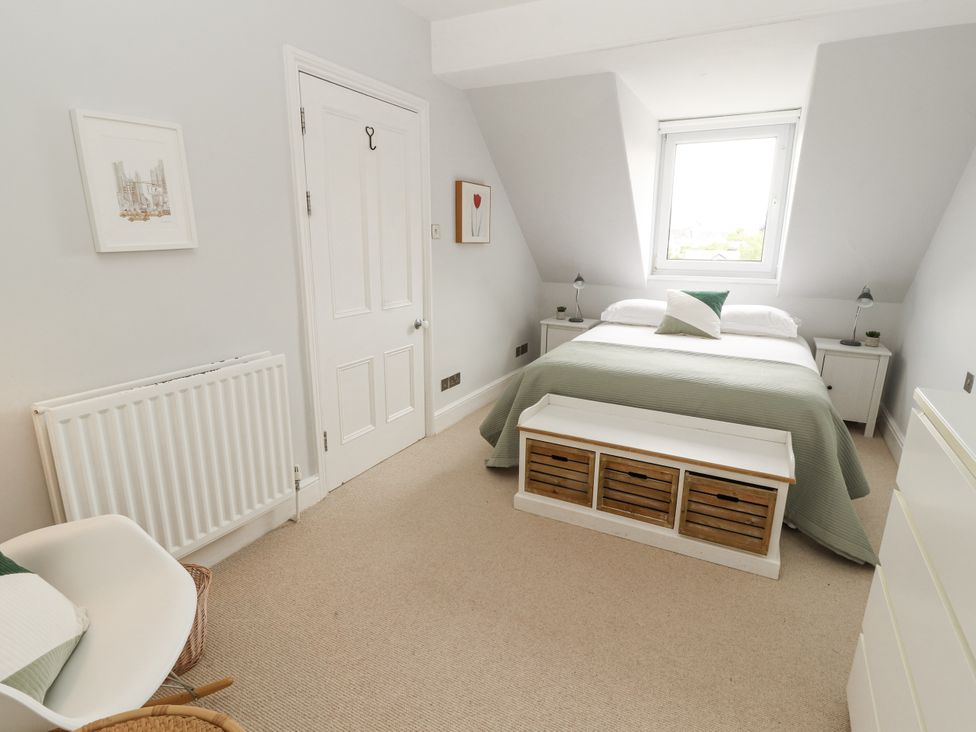 A bedroom with a bed and window at 43 Station Road in Keswick