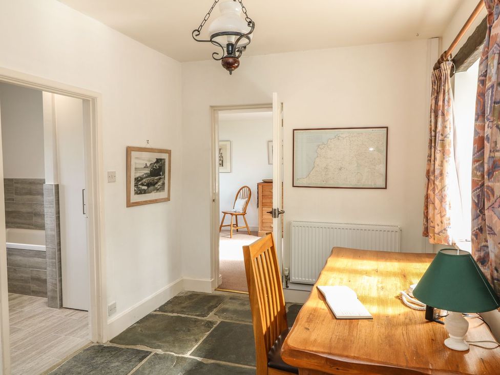 An office with a table and a chair at Tremorla in Boscastle