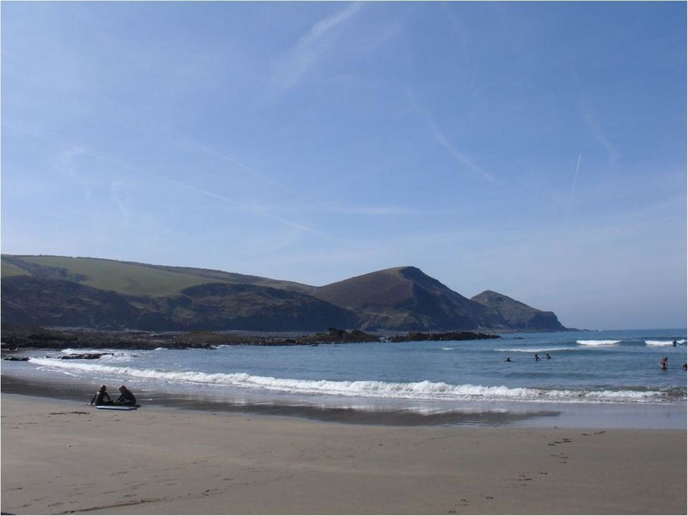 A beach with people enjoying the water at Tremorla in Boscastle