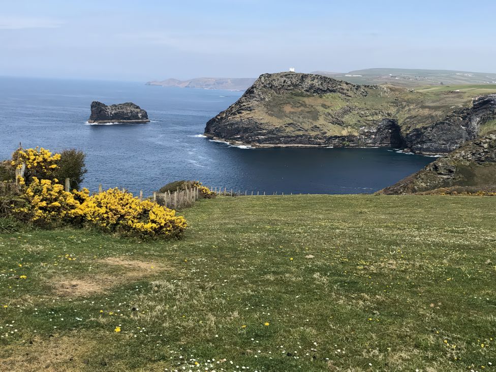 A coastal view with cliffs and water at Tremorla in Boscastle