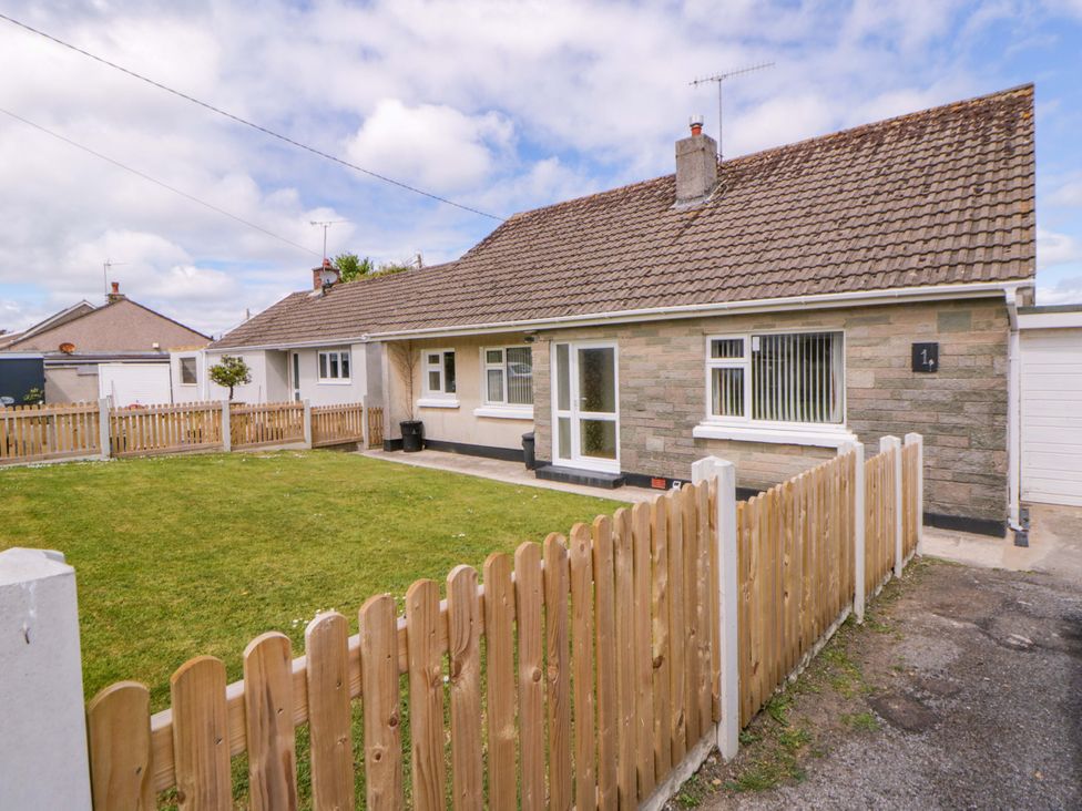 A house with a garden and fence at No.1 Vanderhoof Way Saundersfoot