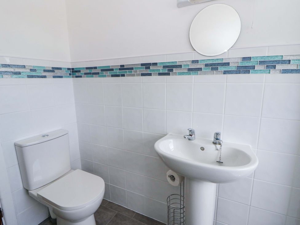 A bathroom with toilet and hand basin at No.1 Vanderhoof Way Saundersfoot