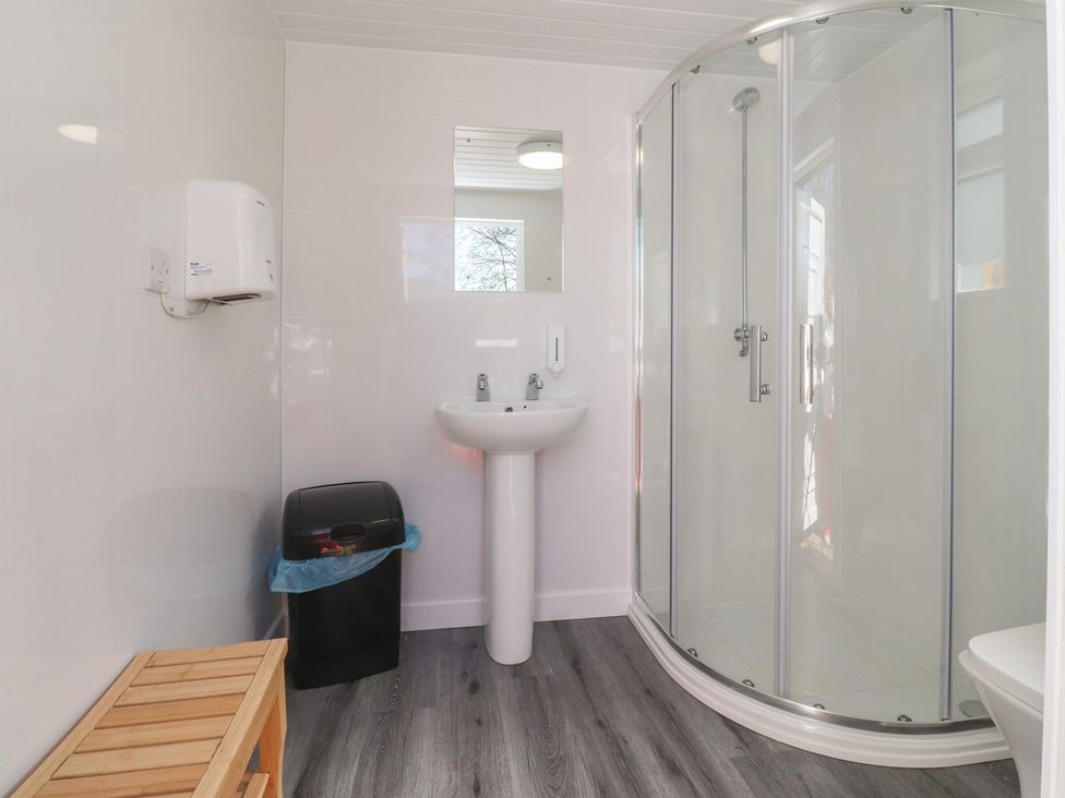 A bathroom with shower and sink at Butterfly Hut 1 Forton near Garstang