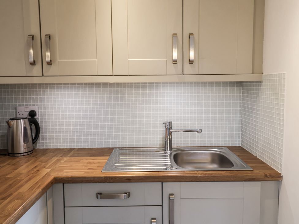 A kitchen with a sink and kettle at The Annex next to St Johns Southwold