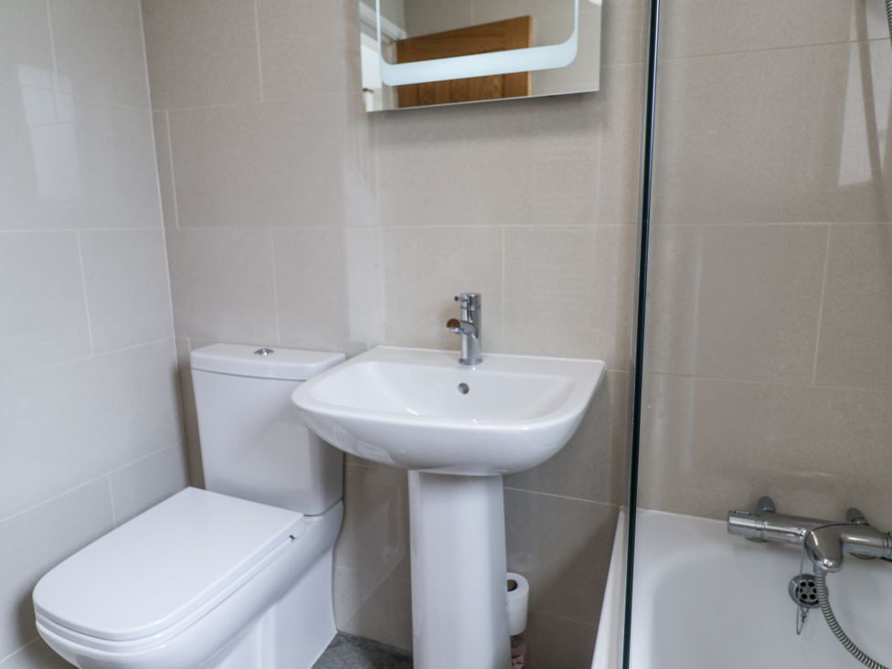 A bathroom with a sink and toilet at The Annex next to St Johns Southwold