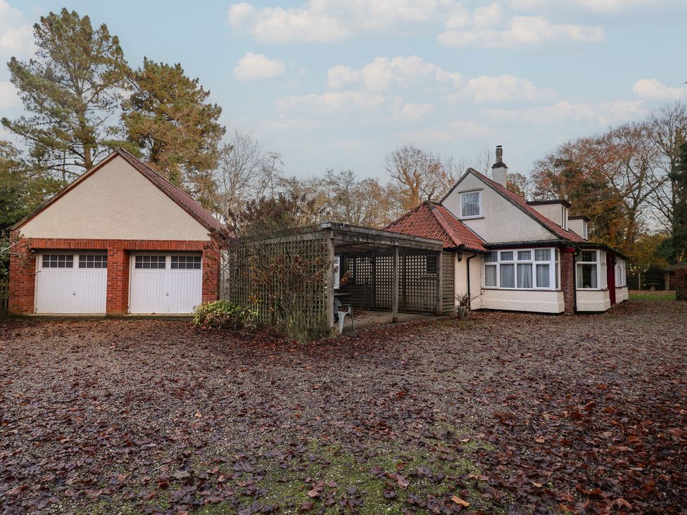 A house with a garage and a pergola at The Anchorage in 