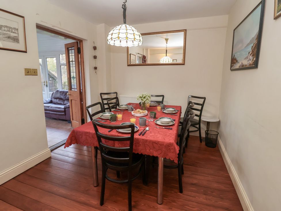 A dining room with a table set for a meal at The Anchorage in 