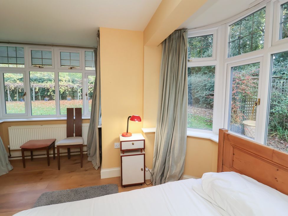 A bedroom with a bed and a nightstand at The Anchorage