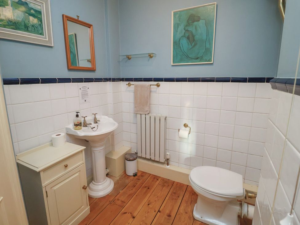A bathroom with a sink and toilet at The Anchorage in 