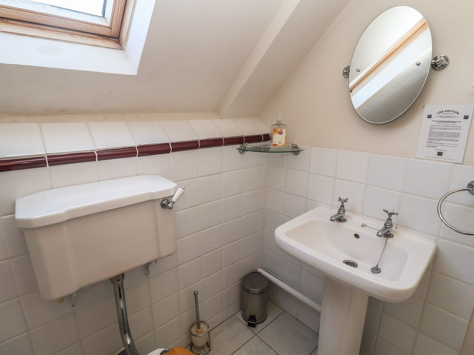 A bathroom with a toilet and sink at The Anchorage