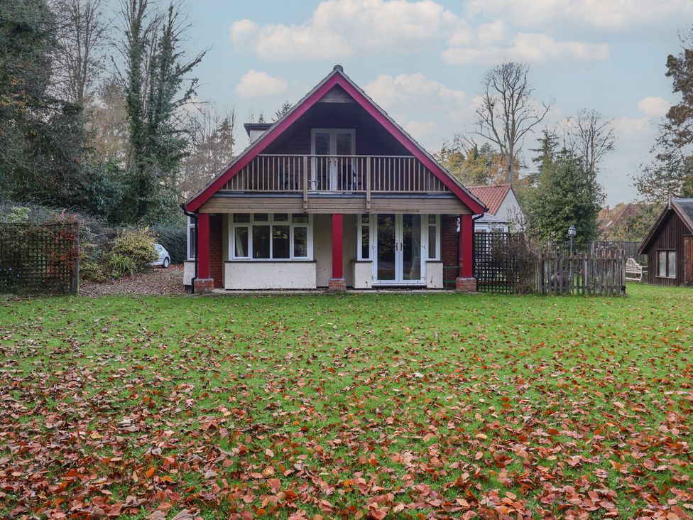 A house with a balcony and grass area at The Anchorage