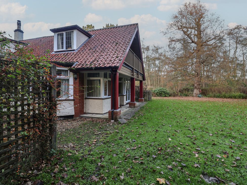 A house with a garden and trees at The Anchorage