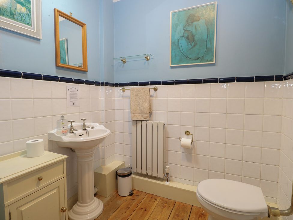 A bathroom with a sink and toilet at The Anchorage in Hoveton & Wroxham