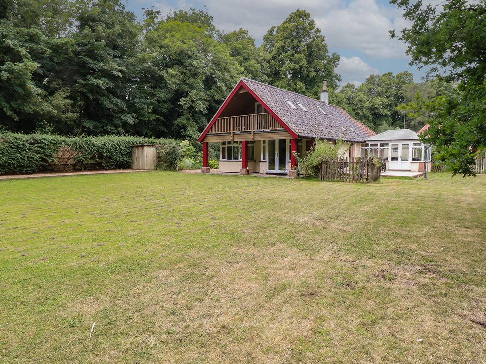 A house with a garden and balcony at The Anchorage in Hoveton & Wroxham