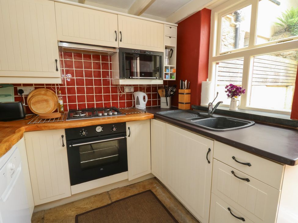 A kitchen with a sink and oven at St John's House in Newport, Pembrokeshire