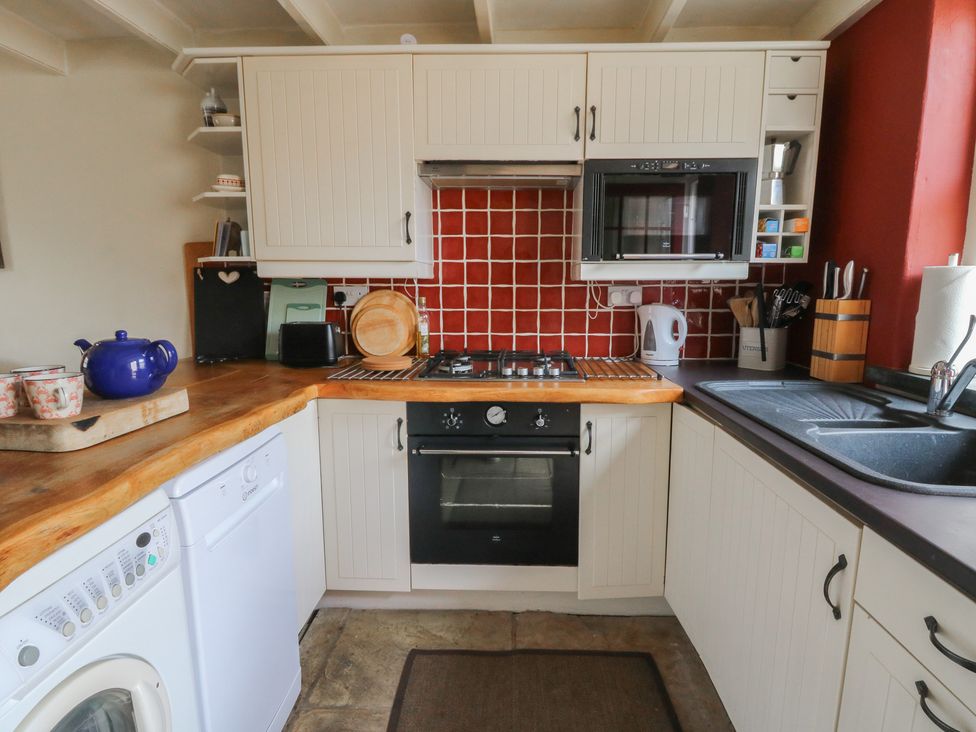 A kitchen with appliances and utensils at St John's House Newport, Pembrokeshire