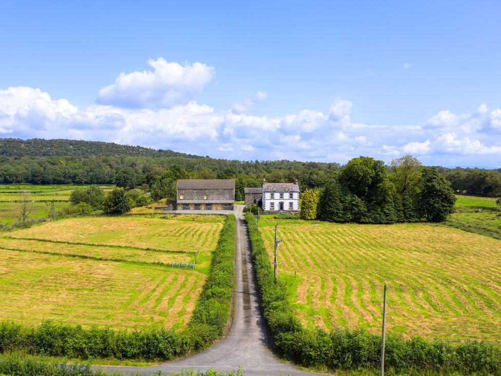 A rural landscape with buildings and fields at Grove House in Grange-Over-Sands