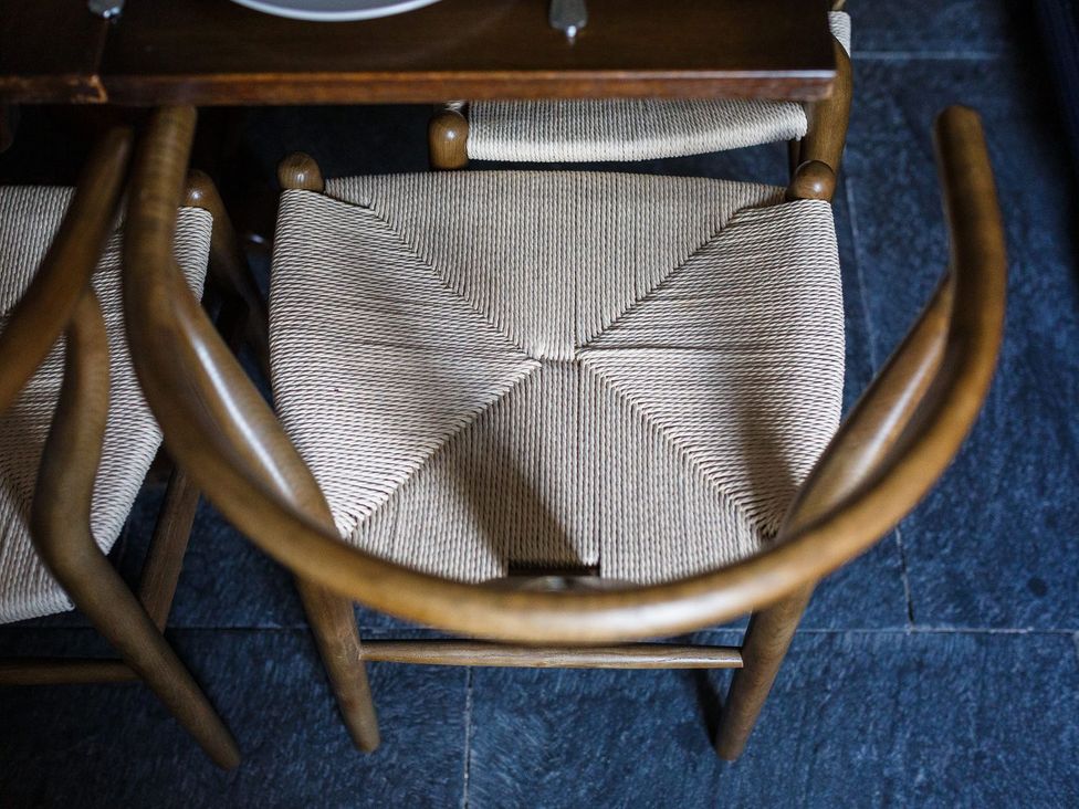 A chair with woven seat at Grove House in Grange-Over-Sands