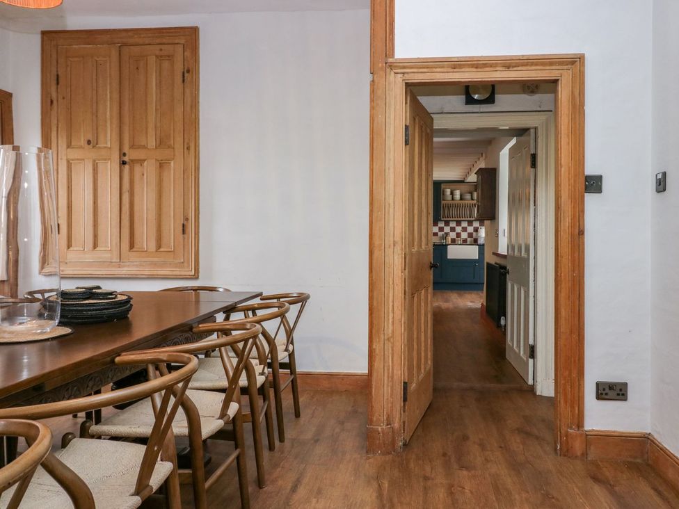 A dining room with a table and chairs at Grove House in Grange-Over-Sands