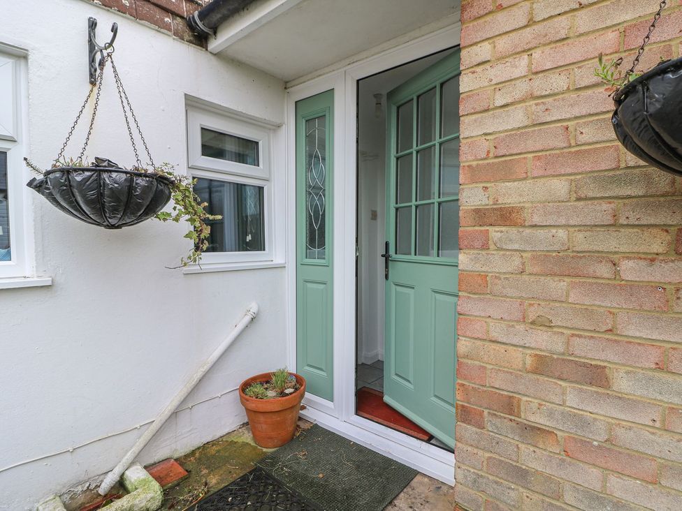 An entrance with a front door and planters at 3 Seaview Cottages Normans Bay near Bexhill-on-Sea