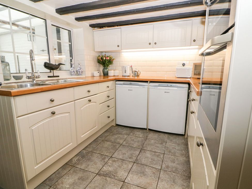A kitchen with sink and appliances at 2 Seaview Cottages Normans Bay near Bexhill-On-Sea
