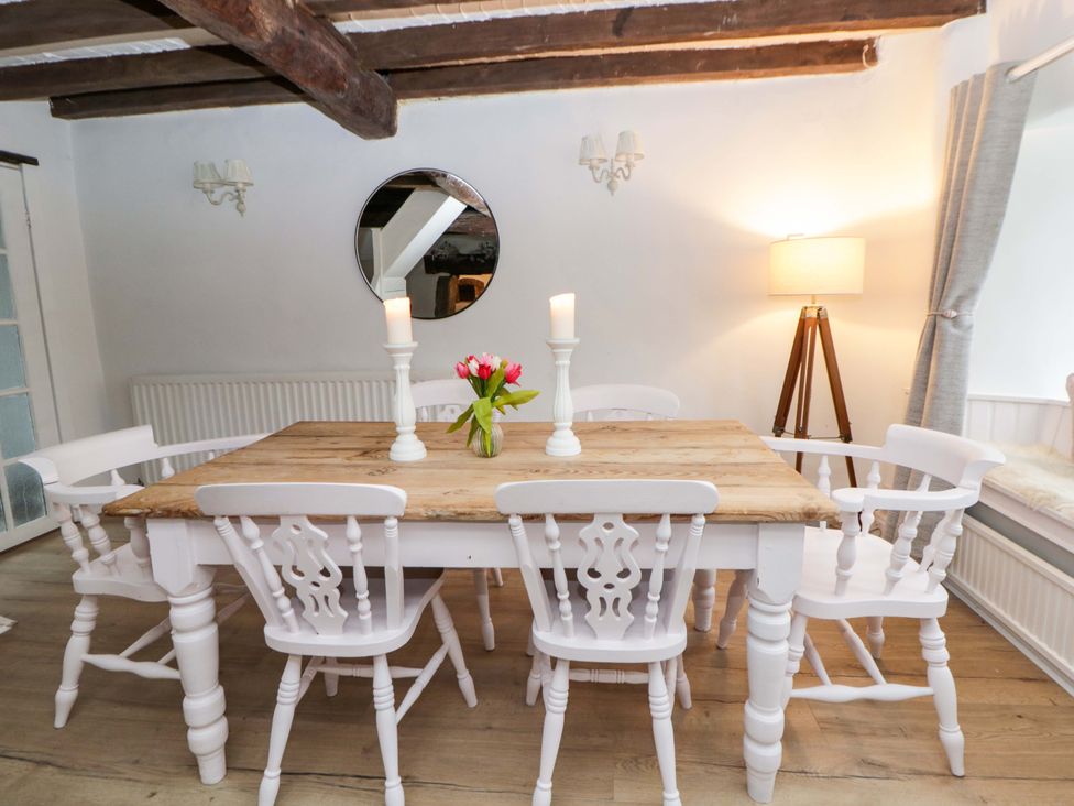 A dining room with a table and chairs at The Old Shop in Builth Wells