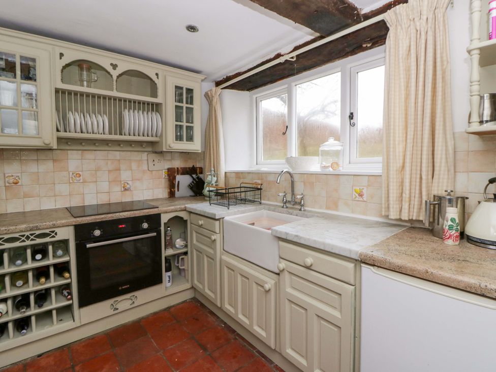 A kitchen featuring cabinets, sink, and oven at The Old Shop in Builth Wells
