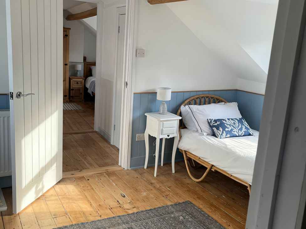 A bedroom with a bed and a nightstand at 21 Station Hill
