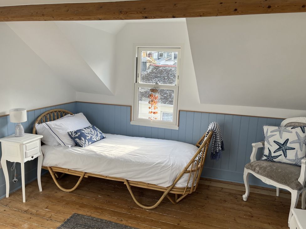 A bedroom with a bed and bedside table at 21 Station Hill