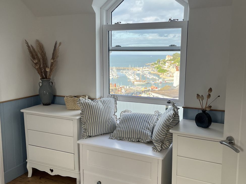 A bedroom with a view of the harbor at 21 Station Hill