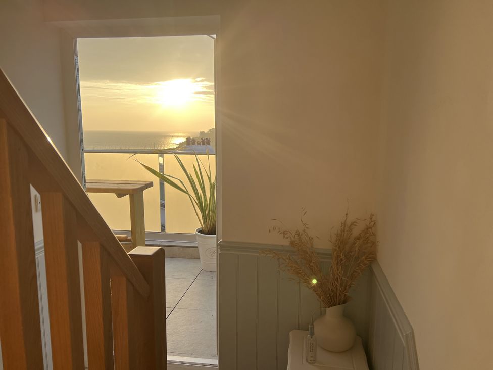A staircase leading to an ocean view at Still Waters in Brixham