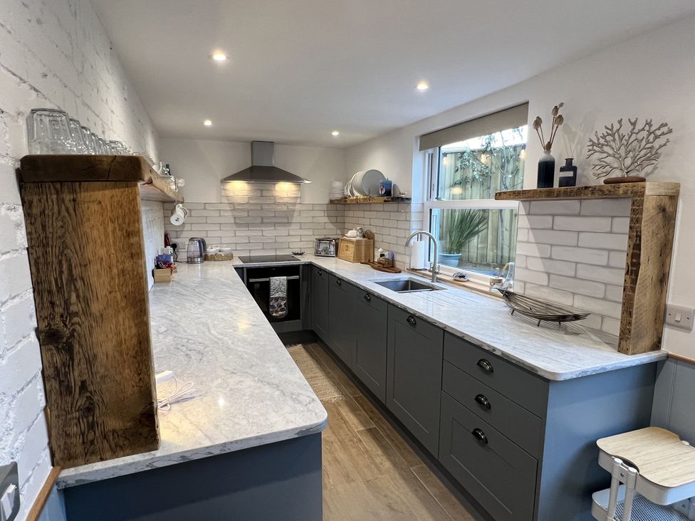 A kitchen with a countertop and sink at Still Waters in Brixham