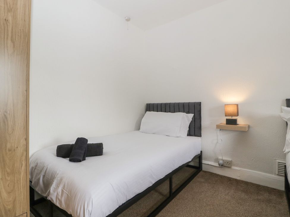 A bedroom with a bed and a nightstand at Penny Farthing Inn Aston Crews near Ross-On-Wye