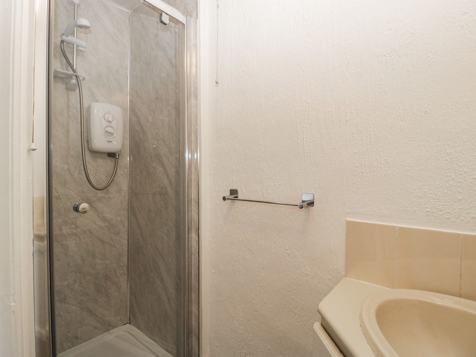 A bathroom with a shower and sink at Penny Farthing Inn Aston Crews near Ross-On-Wye