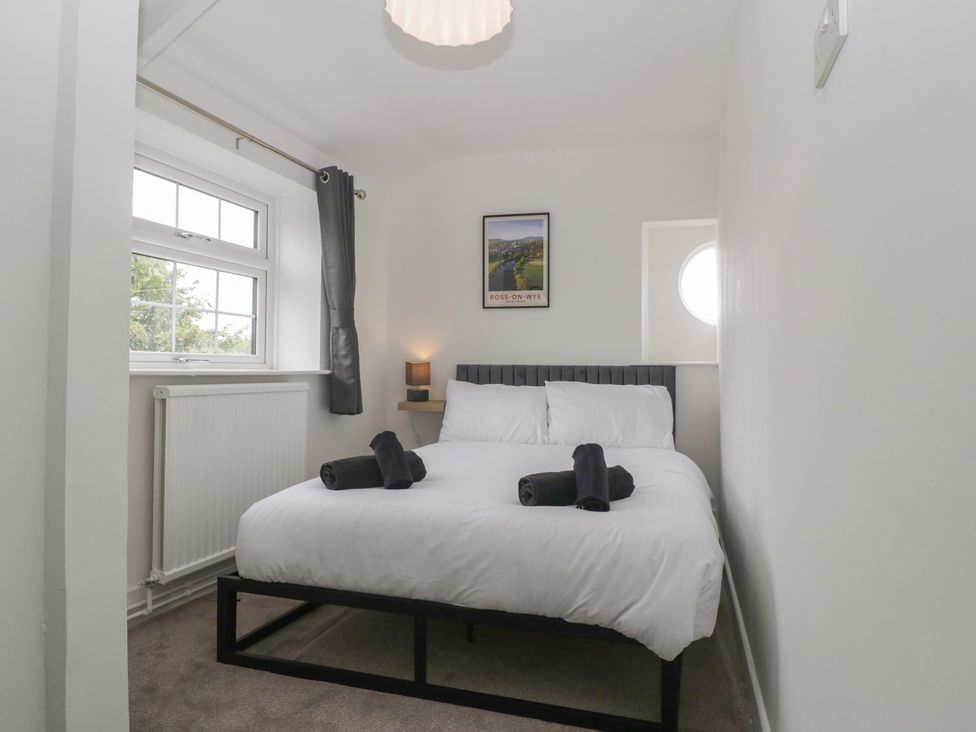 A bedroom with a bed and towels at Penny Farthing Inn Aston Crews near Ross-On-Wye