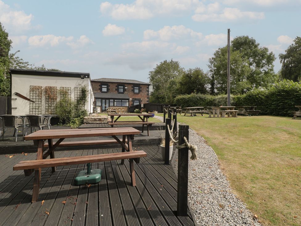 An outdoor area with tables and chairs at Penny Farthing Inn Aston Crews near Ross-On-Wye