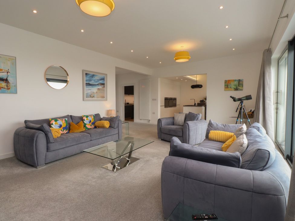 A living room with sofas and a coffee table at 70 Deganwy Road in Deganwy