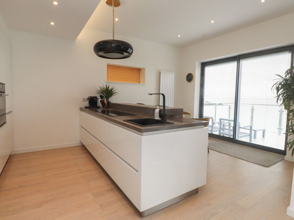 A kitchen with a sink and counter at 70 Deganwy Road in Deganwy