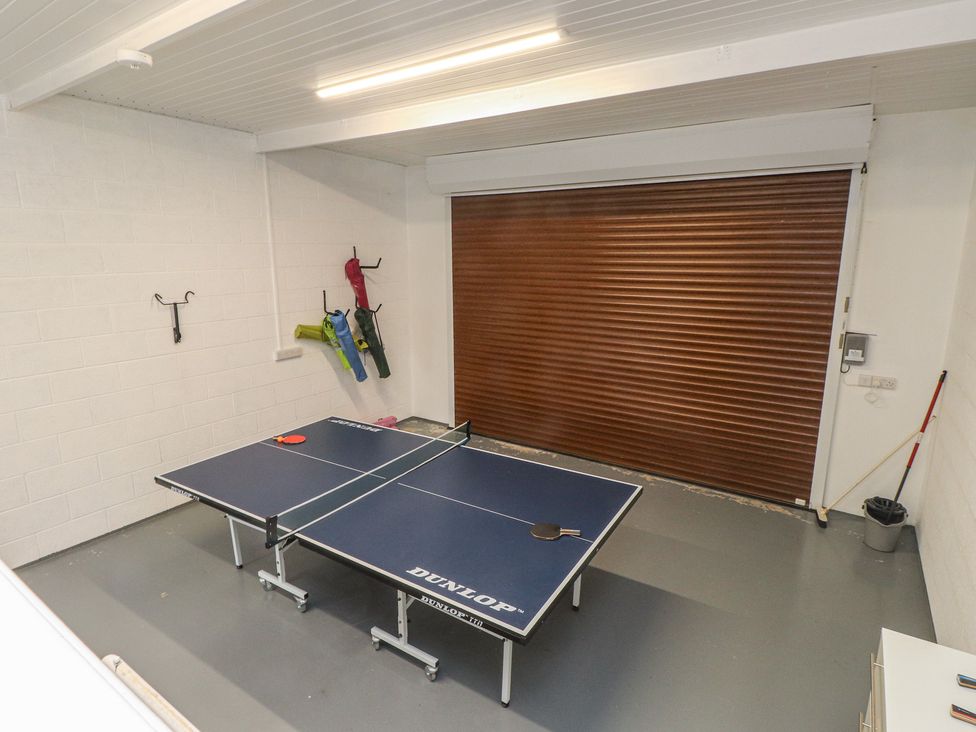 A games room with a ping pong table at 70 Deganwy Road in Deganwy