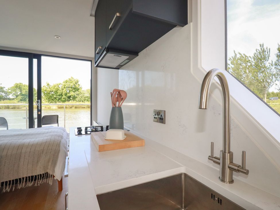 A kitchen with sink and utensils at The Lake Boat exclusive retreat Black Cross near St Columb Major