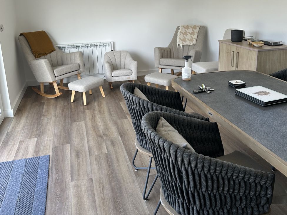 A dining room with a table and chairs at The Lake Boat exclusive retreat Black Cross near St Columb Major