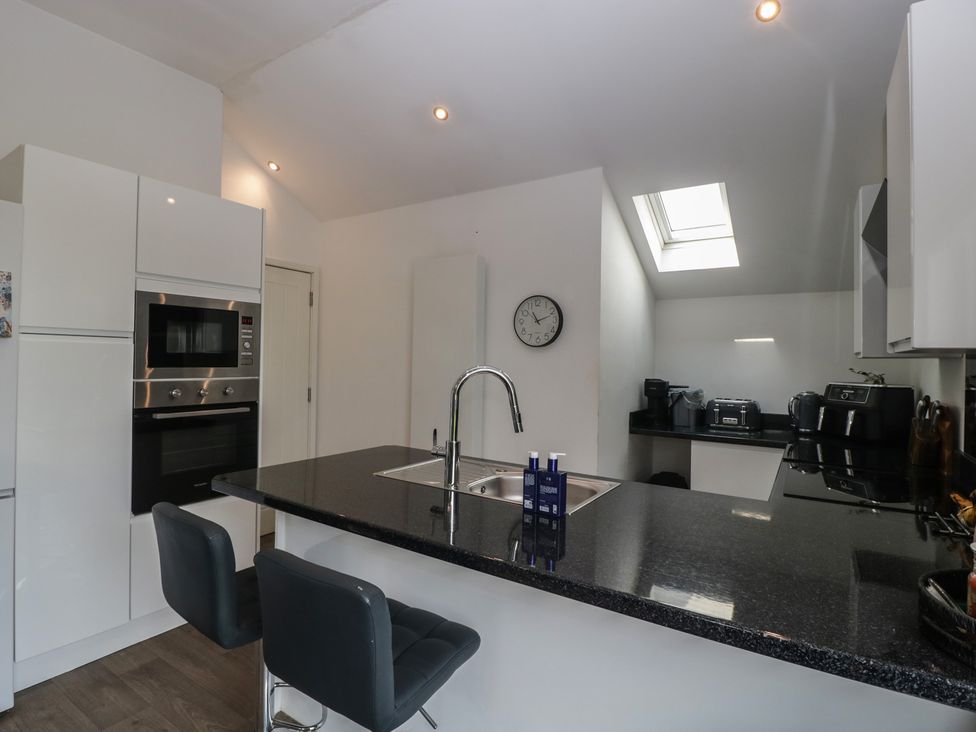 A kitchen with a sink and appliances at The Annex in 