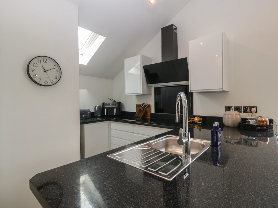 A kitchen with counter and appliances at The Annex