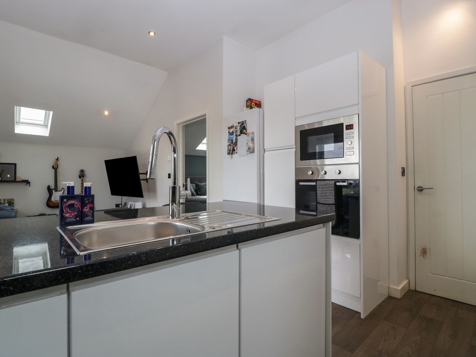 A kitchen with a sink and appliances at The Annex in 